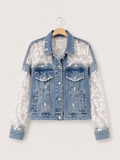 Denim jacket with lace and sequin sleeves on a hanger against a white background